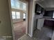 View from kitchen toward the living area, showcasing floors and cabinetry at 1243 Hill Nw St, Conyers, GA 30012