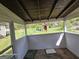 Enclosed porch area with wooden ceiling and view to backyard at 1243 Hill Nw St, Conyers, GA 30012
