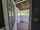 Enclosed porch with multiple windows offering exterior views of the backyard at 1243 Hill Nw St, Conyers, GA 30012