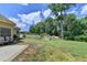 Spacious backyard with lush green grass, shed, mature trees, and partial fence at 1815 Sharon Rd, Cumming, GA 30041