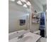 Bathroom includes simple vanity, commode, tub and shower with blue accents at 1815 Sharon Rd, Cumming, GA 30041