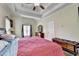 Cozy bedroom with vaulted ceilings, plush bedding, ample natural light, and wood dresser at 1815 Sharon Rd, Cumming, GA 30041