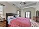 Bright bedroom with large windows and a ceiling fan at 1815 Sharon Rd, Cumming, GA 30041