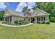 Charming single-Gathering home with stone accents, a landscaped front yard, and a well-maintained lawn at 1815 Sharon Rd, Cumming, GA 30041