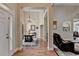 Inviting foyer with wood flooring, chandelier, and open view to living spaces, creating a welcoming entrance at 1815 Sharon Rd, Cumming, GA 30041