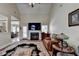 Inviting living room boasts a vaulted ceiling, a fireplace, and a beautiful decorative rug at 1815 Sharon Rd, Cumming, GA 30041
