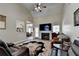 Inviting living room boasts a vaulted ceiling, a fireplace, and a beautiful decorative rug at 1815 Sharon Rd, Cumming, GA 30041