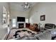 Inviting living room boasts a vaulted ceiling, a fireplace, and a beautiful decorative rug at 1815 Sharon Rd, Cumming, GA 30041
