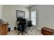 Home office features plush carpeting, neutral paint and large windows at 1815 Sharon Rd, Cumming, GA 30041