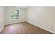 Cozy bedroom with wood flooring and a window with a view at 3684 Regent Nw Dr, Kennesaw, GA 30144