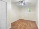 Bright bedroom featuring a ceiling fan, window and a closet at 3684 Regent Nw Dr, Kennesaw, GA 30144