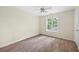Bedroom with wood-look flooring, a window, and a ceiling fan at 3684 Regent Nw Dr, Kennesaw, GA 30144