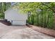 Exterior elevation showing garage with driveway entrance at 3684 Regent Nw Dr, Kennesaw, GA 30144