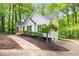 Side view of a well-maintained home featuring green shutters and a cozy deck at 3684 Regent Nw Dr, Kennesaw, GA 30144