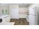 Kitchen featuring white cabinets, modern appliances, and plenty of counter space at 3684 Regent Nw Dr, Kennesaw, GA 30144