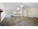 Open-concept living area with a stone fireplace, leading to a kitchen with bar seating at 3684 Regent Nw Dr, Kennesaw, GA 30144