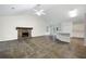 Spacious living room featuring a stone fireplace, high ceilings, and an open floor plan at 3684 Regent Nw Dr, Kennesaw, GA 30144