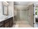 Bathroom boasting a glass enclosed shower and a large vanity area at 6763 Encore Blvd, Atlanta, GA 30328