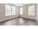 Bright bedroom with hardwood floors and large windows providing natural light at 6763 Encore Blvd, Atlanta, GA 30328