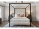 Well appointed bedroom showcasing a stylish canopy bed and neutral decor at 6763 Encore Blvd, Atlanta, GA 30328
