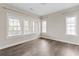 Bedroom with hardwood floors and large windows allowing ample natural light at 6763 Encore Blvd, Atlanta, GA 30328