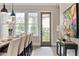 Charming dining space featuring stylish decor, natural light, and backyard access at 6763 Encore Blvd, Atlanta, GA 30328