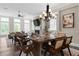 The open dining area boasts modern lighting and flows seamlessly into the living space at 6763 Encore Blvd, Atlanta, GA 30328