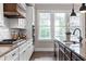 This updated kitchen features granite counters, stainless appliances, and ample cabinet space at 6763 Encore Blvd, Atlanta, GA 30328