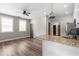 Bright kitchen with granite countertops, stainless steel appliances, and an open view into the living area at 6763 Encore Blvd, Atlanta, GA 30328