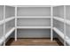 Spacious walk-in pantry with multiple shelves providing ample storage at 6763 Encore Blvd, Atlanta, GA 30328
