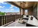 Covered outdoor patio space with comfortable seating and neighborhood views at 6763 Encore Blvd, Atlanta, GA 30328