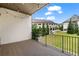 Relaxing patio area with string lights overlooking a grassy lawn and neighborhood at 6763 Encore Blvd, Atlanta, GA 30328