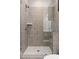 The shower has gray stone tiles and a glass surround at 6763 Encore Blvd, Atlanta, GA 30328