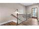 Staircase with wooden railing and hardwood floors at 6763 Encore Blvd, Atlanta, GA 30328