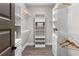 Organized walk-in closet with built-in shelving, drawers, and wood floors at 6763 Encore Blvd, Atlanta, GA 30328