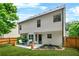 Spacious backyard perfect for entertaining, featuring a patio with furniture, and a grassy area at 1326 Castleberry Dr, Buford, GA 30518