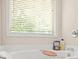 Bright bathroom with window above the soaking tub, enhancing a spa-like atmosphere at 1326 Castleberry Dr, Buford, GA 30518