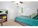 Bedroom with vaulted ceiling and a TV with decorative letters displayed above a comfortable bed at 1326 Castleberry Dr, Buford, GA 30518