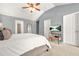 Bedroom featuring vaulted ceiling, ceiling fan, and TV on a wooden stand at 1326 Castleberry Dr, Buford, GA 30518