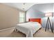 Bedroom featuring a vaulted ceiling, a statement lamp, and a full size bed with a coral colored headboard at 1326 Castleberry Dr, Buford, GA 30518