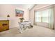 Bright home office space with a white desk, a large window, and natural light; perfect for working from home at 1326 Castleberry Dr, Buford, GA 30518