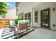 Cozy outdoor patio with stylish furniture, a striped rug, and lush greenery offers a relaxing space to unwind at 1326 Castleberry Dr, Buford, GA 30518
