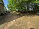Relaxing backyard with an outdoor seating area, perfect for enjoying peaceful moments in a natural setting at 4305 Evans Farms Dr, Cumming, GA 30040