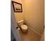This bathroom features a toilet with a tiled floor and a decorative picture on the wall at 4305 Evans Farms Dr, Cumming, GA 30040