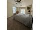 Bedroom featuring two large windows and a ceiling fan offering plenty of natural light at 4305 Evans Farms Dr, Cumming, GA 30040