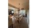 Elegant dining room with a stylish chandelier, ample seating, and views of the living area at 4305 Evans Farms Dr, Cumming, GA 30040