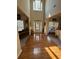 Bright foyer with hardwood floors, high ceilings, and natural light streaming through the front door at 4305 Evans Farms Dr, Cumming, GA 30040