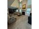Inviting living room with a cozy fireplace, large windows, and comfortable seating area at 4305 Evans Farms Dr, Cumming, GA 30040