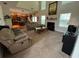 Warm and inviting living room with a fireplace, comfortable sofas, and easy access to the kitchen at 4305 Evans Farms Dr, Cumming, GA 30040
