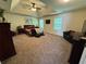 Spacious main bedroom with ceiling fan, multiple windows, and plush carpet at 4305 Evans Farms Dr, Cumming, GA 30040